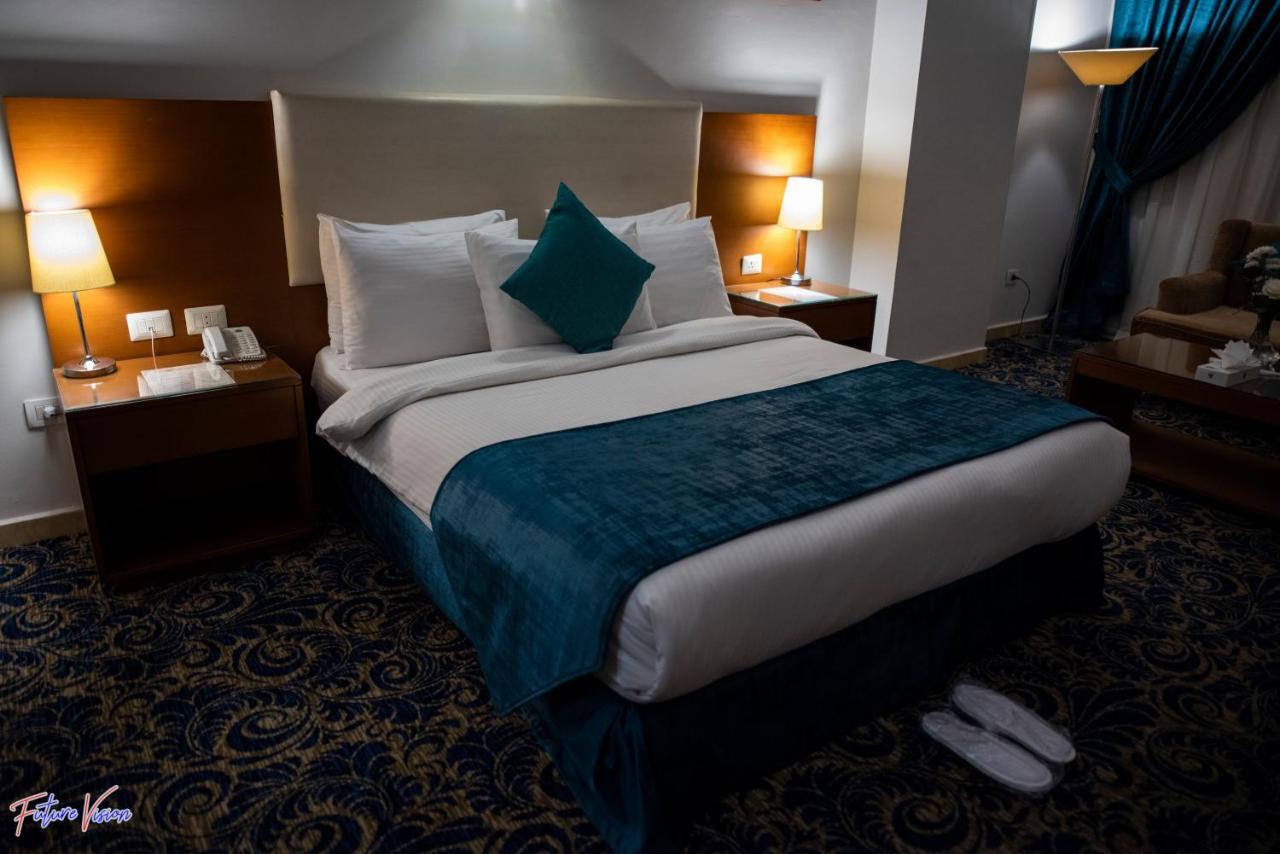 Rehana Plaza Hotel Kahire Dış mekan fotoğraf A bedroom at the hotel